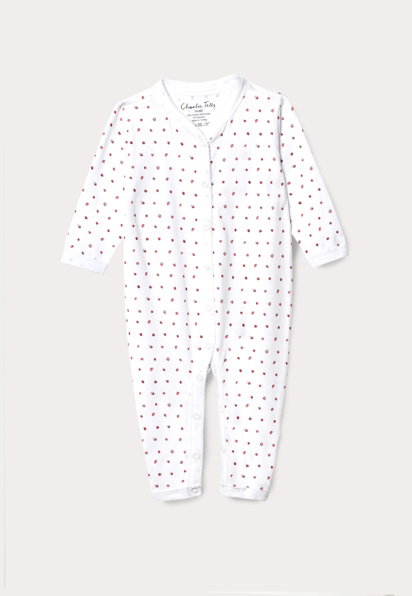 Pyjamas för baby med broderi och smultron
