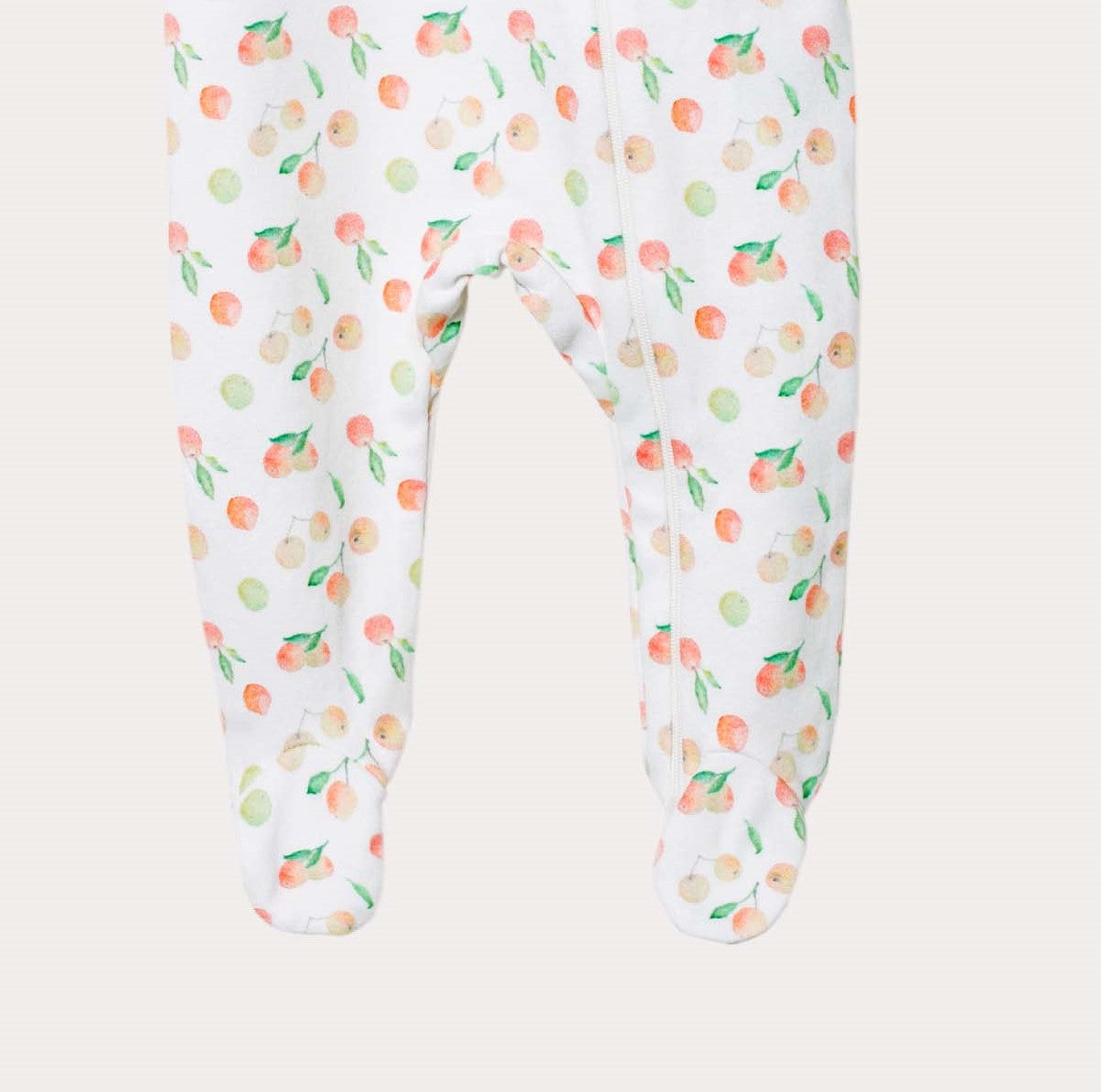 Pyjamas med fot för baby i ekologisk bomull med äpplen