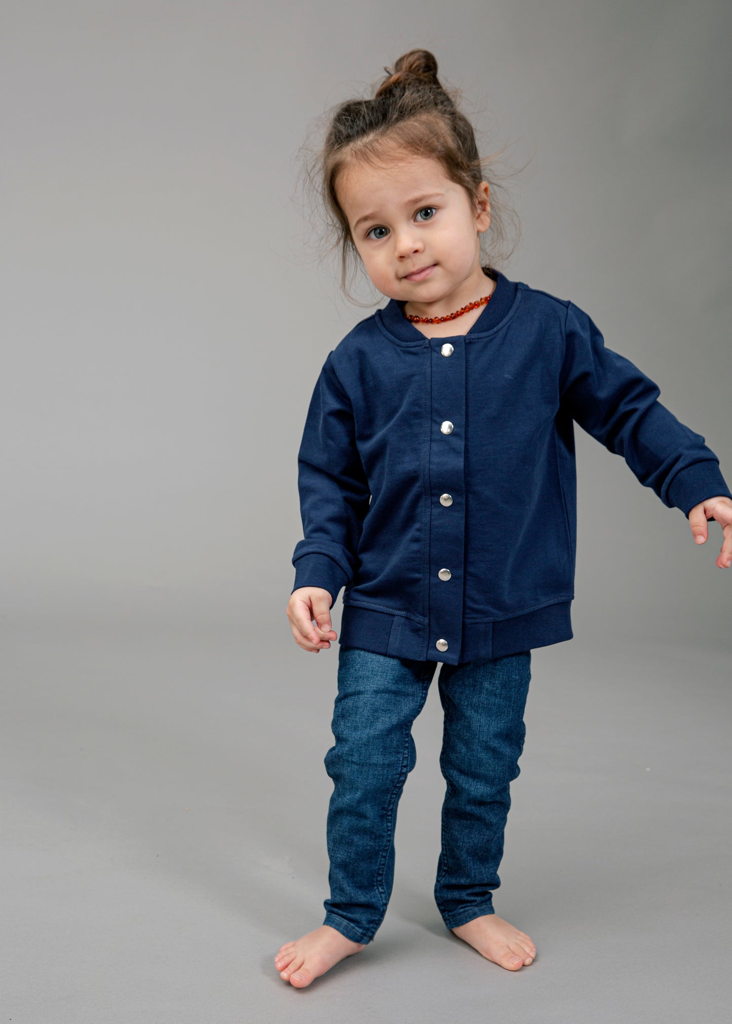 Navy blue bomber jacket with embroidered text