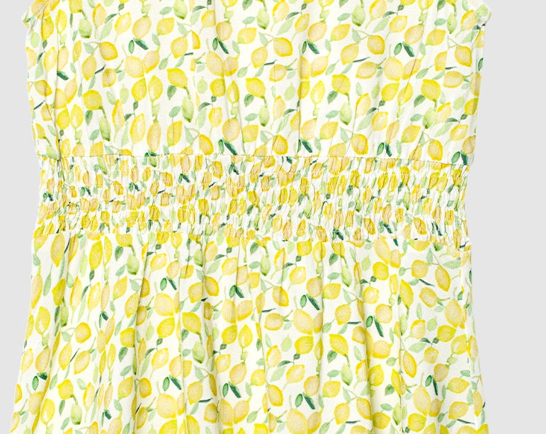 Klänning med smock och citronprint